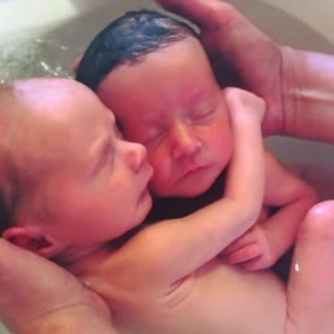 Newborn twins don’t realize they’ve been born, refuse to stop cuddling like they did in the womb